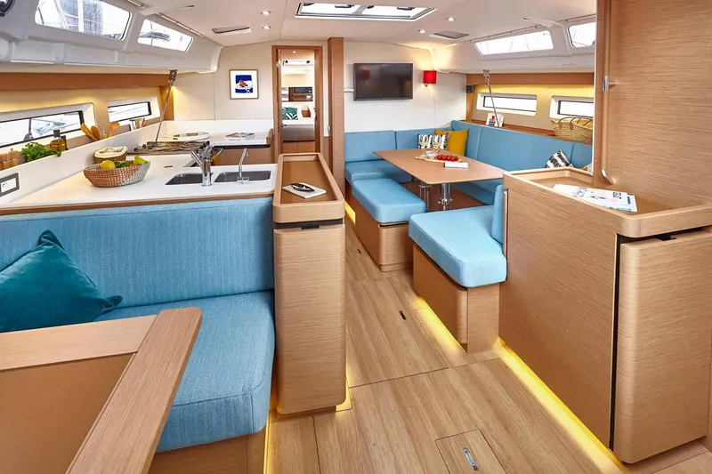 Slide: The Image of 2026 Jeanneau Sun Odyssey 490 interior with modern kitchen and seating area. - 18