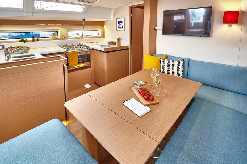 Slide: The Image of Interior of 2026 Jeanneau Sun Odyssey 490 yacht with modern kitchen and dining area. - 19