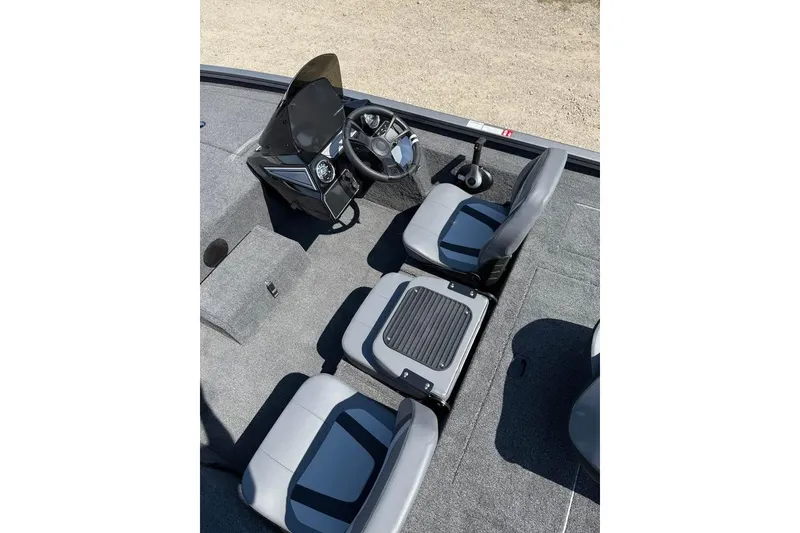 Slide: The Image of 2026 Lowe Stinger 175C boat interior with steering console and seating. - 7