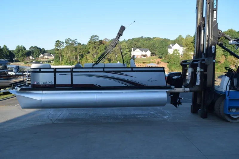 The Image of 2023 Qwest 818 XRE E Class XRE Fish LT pontoon boat on forklift. - 1
