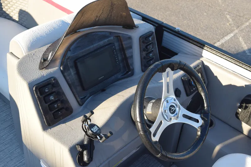 Slide: The Image of 2023 Qwest 818 XRE E Class XRE Fish LT boat dashboard with steering wheel and controls. - 10