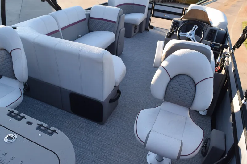 Slide: The Image of 2023 Qwest 818 XRE E Class XRE Fish LT boat interior with plush seating and steering console. - 6