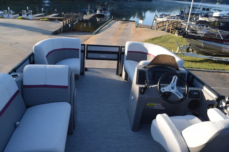 Slide: The Image of 2023 Qwest 818 XRE E Class XRE Fish LT pontoon boat interior with seating and steering console. - 7