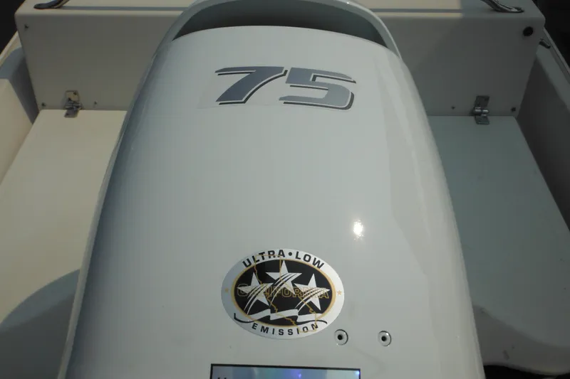 Slide: The Image of Boston Whaler 17 Super Sport 1988 boat engine with "75" and ultra-low emission label. - 15