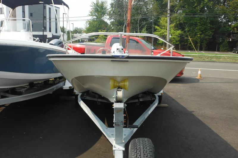 Slide: The Image of 1988 Boston Whaler 17 Super Sport boat on trailer, parked outdoors. - 3