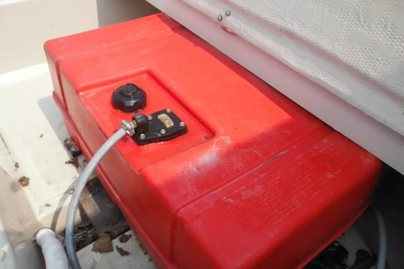 Slide: The Image of Red fuel tank in a 1988 Boston Whaler 17 Super Sport boat. - 35