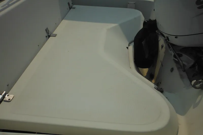 Slide: The Image of 1988 Boston Whaler 17 Super Sport boat interior with engine detail. - 38