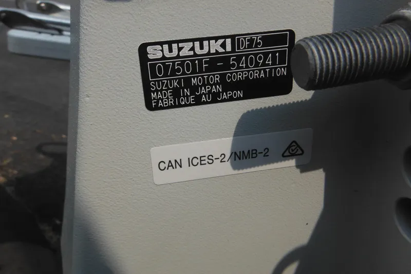 Slide: The Image of Label on Suzuki DF75 motor, made in Japan, attached to 1988 Boston Whaler 17 Super Sport. - 41