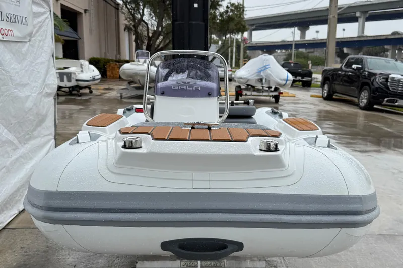 Slide: The Image of 2026 Gala A300L inflatable boat displayed outdoors on a rainy day. - 13