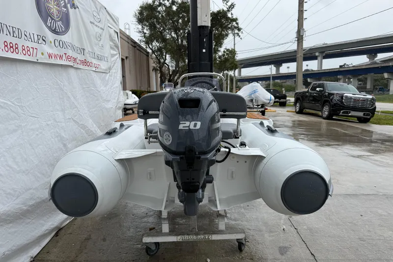 Slide: The Image of 2026 Gala A300L inflatable boat with 20HP motor, displayed outdoors on a rainy day. - 4