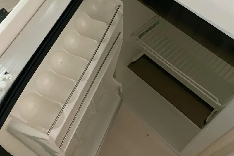 Slide: The Image of Empty refrigerator interior on a 2005 Tiara Yachts 3600 Sovran. - 20