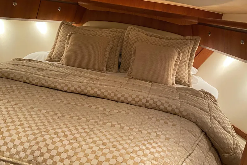 Slide: The Image of Luxurious cabin interior of 2005 Tiara Yachts 3600 Sovran with elegant bedding. - 34
