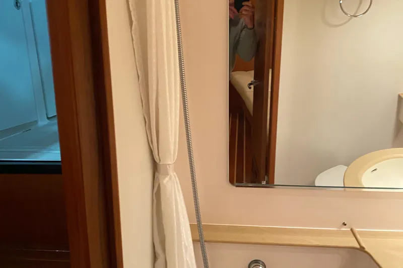 Slide: The Image of Bathroom interior of 2005 Tiara Yachts 3600 Sovran with mirror and shower curtain. - 38