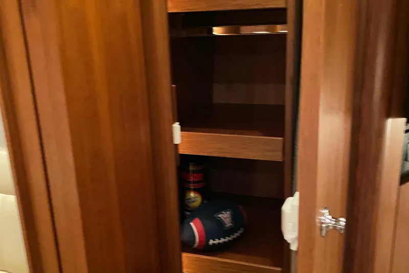 Slide: The Image of Wooden cabinet interior on a 2005 Tiara Yachts 3600 Sovran. - 41
