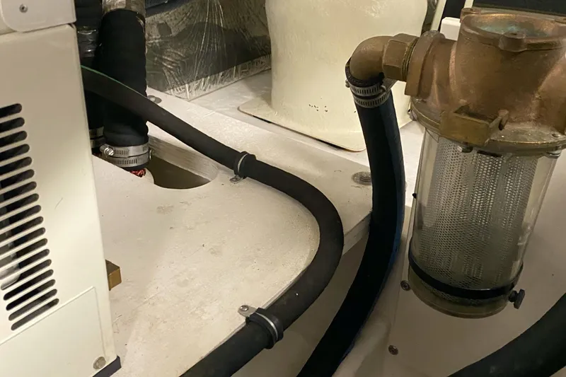 Slide: The Image of Engine room of 2005 Tiara Yachts 3600 Sovran, featuring hoses and filtration system. - 44