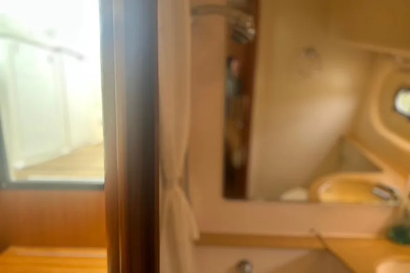 Slide: The Image of Interior view of 2005 Tiara Yachts 3600 Sovran, featuring a cozy cabin space. - 50