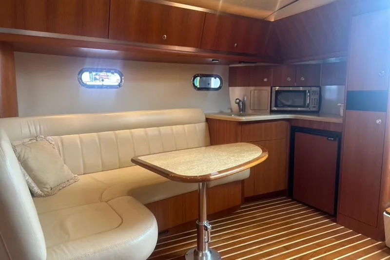 Slide: The Image of Luxurious 2005 Tiara Yachts 3600 Sovran interior with elegant seating and kitchenette. - 53