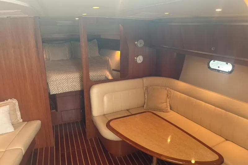 Slide: The Image of 2005 Tiara Yachts 3600 Sovran interior with cozy seating and elegant wood finish. - 55