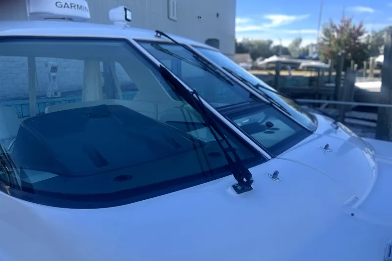 Slide: The Image of 2005 Tiara Yachts 3600 Sovran with Garmin equipment, docked in a marina. - 82