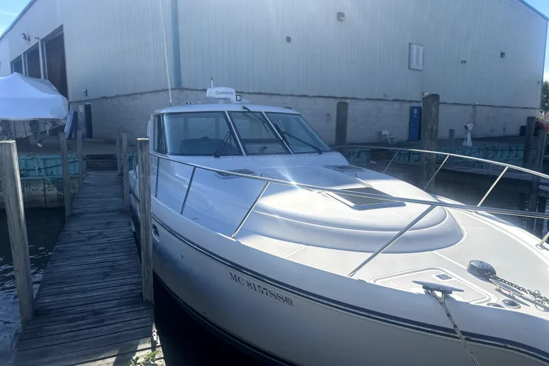 Slide: The Image of 2005 Tiara Yachts 3600 Sovran docked at marina, showcasing sleek design and modern features. - 84