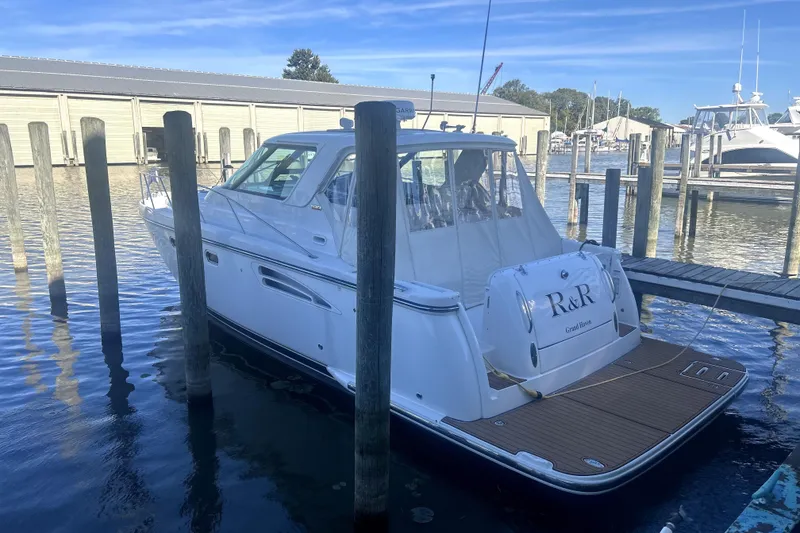 Slide: The Image of 2005 Tiara Yachts 3600 Sovran docked at a marina, rear view. - 90