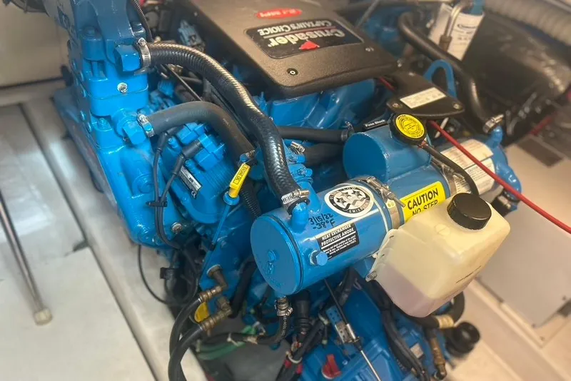 Slide: The Image of Engine compartment of a 2005 Tiara Yachts 3600 Sovran, featuring a blue Cummins diesel engine. - 96
