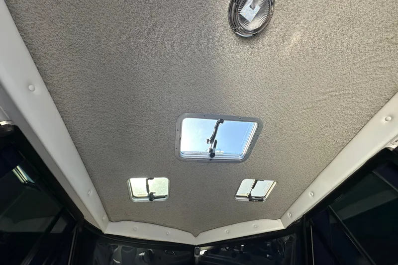 Slide: The Image of Ceiling view of 2004 Glacier Bay 2680 Coastal Runner with skylights and interior lighting. - 11