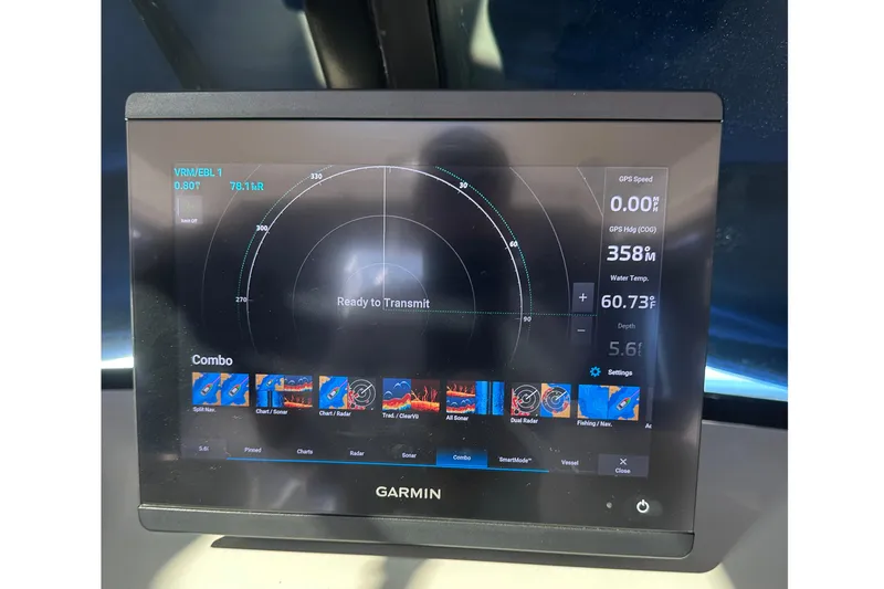 Slide: The Image of Garmin marine display on 2004 Glacier Bay 2680 Coastal Runner, showing navigation and sonar data. - 18