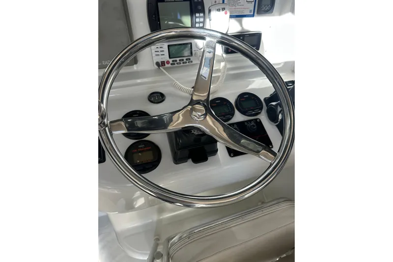 Slide: The Image of Steering wheel and dashboard of 2004 Glacier Bay 2680 Coastal Runner boat. - 20