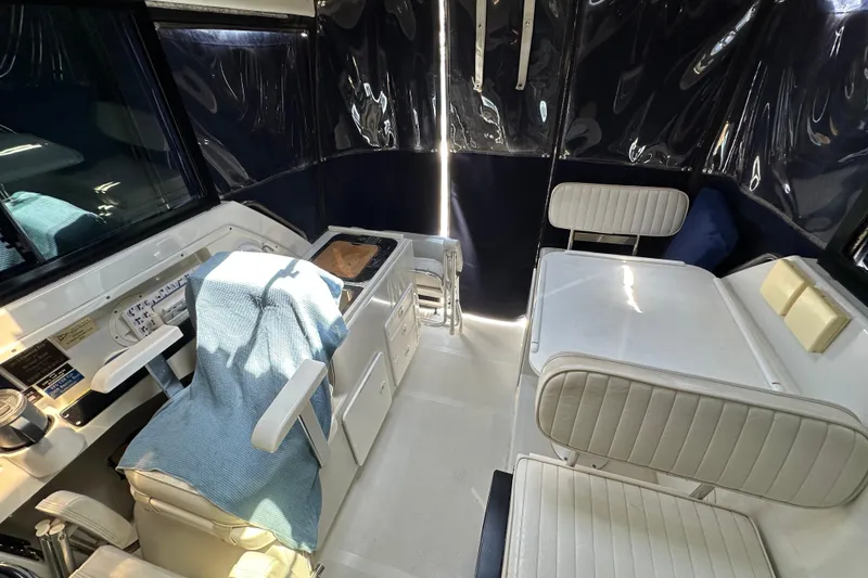 Slide: The Image of Interior of 2004 Glacier Bay 2680 Coastal Runner boat with seating and helm area. - 8