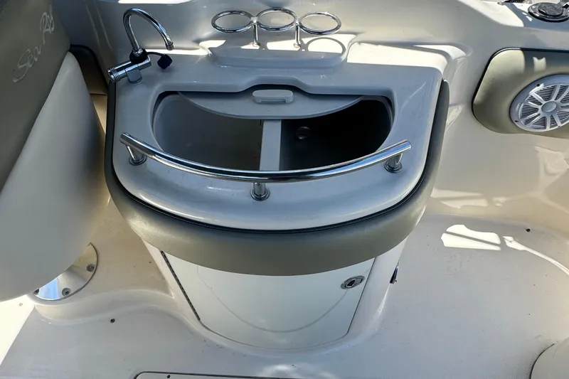 Slide: The Image of 2005 Sea Ray 270 SLX boat on trailer, parked in a residential area. - 10