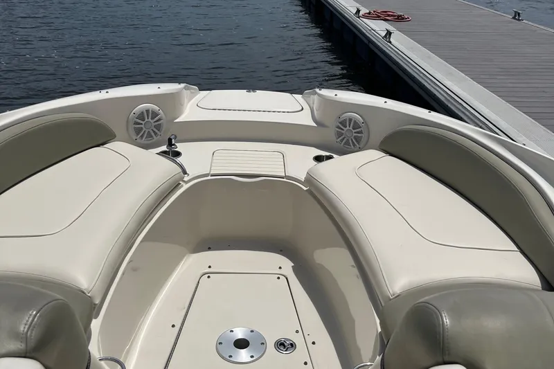 Slide: The Image of Black truck towing a 2005 Sea Ray 270 SLX boat on a sunny street. - 17