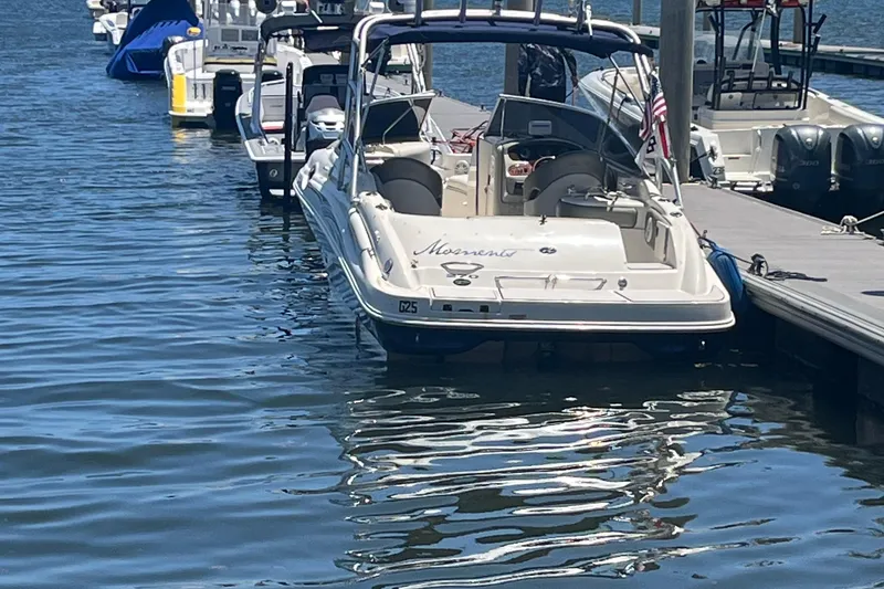 Slide: The Image of 2005 Sea Ray 270 SLX boat on trailer, parked in residential area. - 3