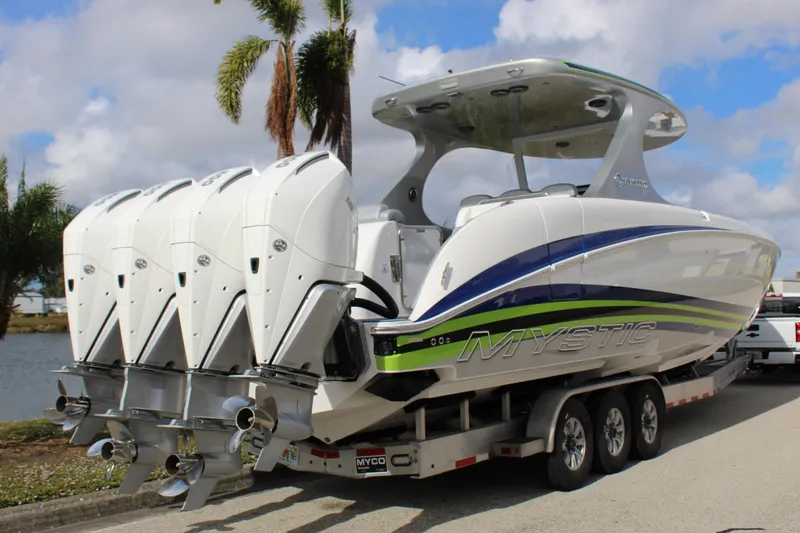 Slide: The Image of 2020 Mystic Powerboats M4200 with quad engines on trailer. - 21