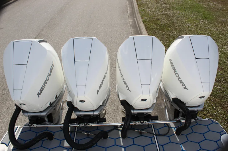 Slide: The Image of Four Mercury outboard engines on a 2020 Mystic Powerboats M4200. - 23