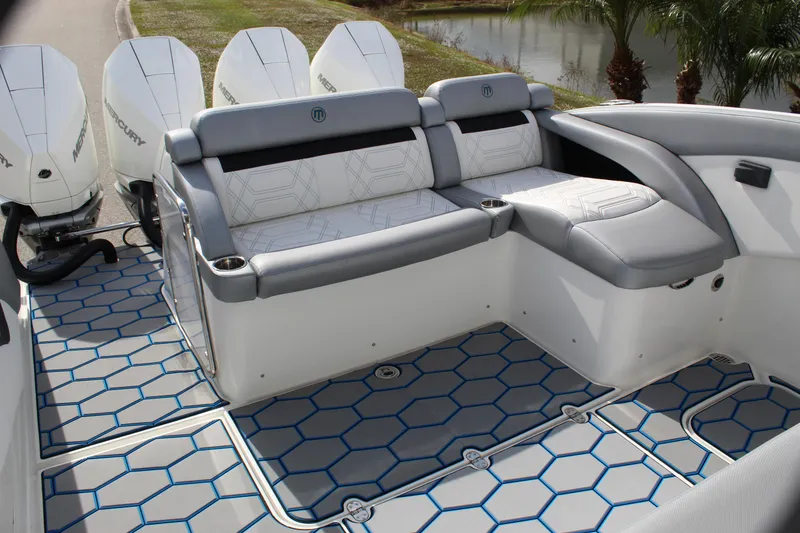 Slide: The Image of 2020 Mystic Powerboats M4200 interior with cushioned seating and modern design. - 28