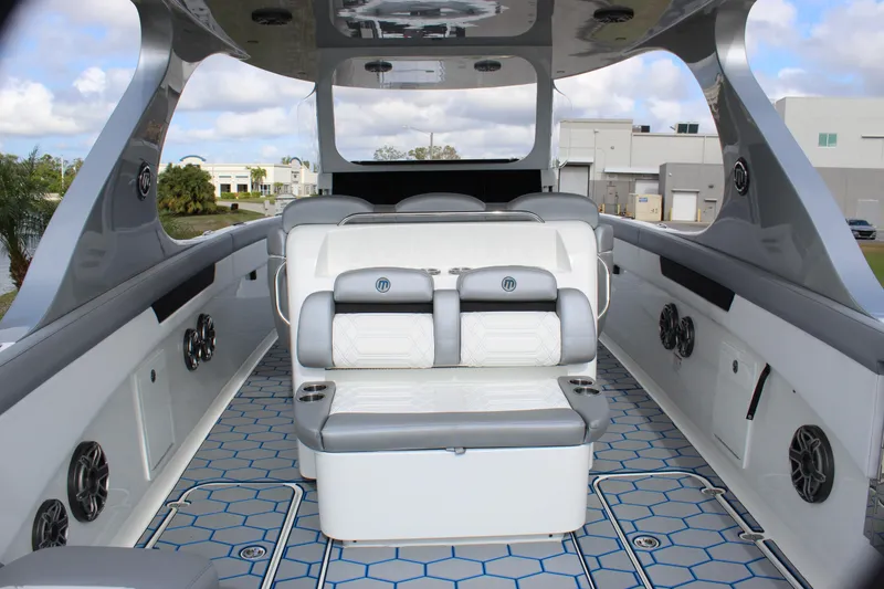 Slide: The Image of 2020 Mystic Powerboats M4200 interior with luxurious seating and modern design. - 29