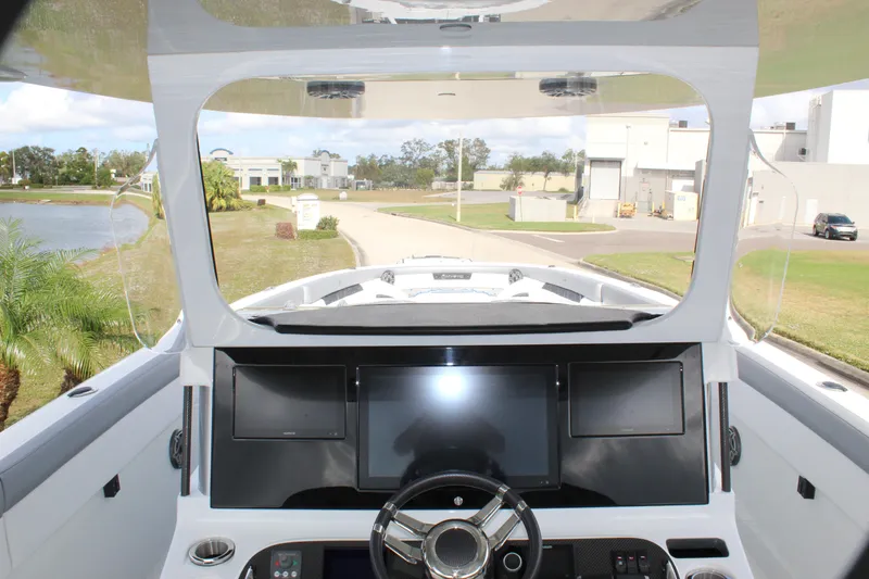 Slide: The Image of 2020 Mystic Powerboats M4200 helm with modern dashboard and steering wheel. - 33