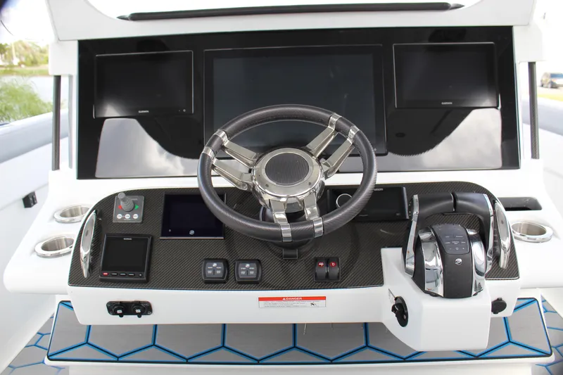 Slide: The Image of 2020 Mystic Powerboats M4200 helm with modern controls and sleek design. - 34