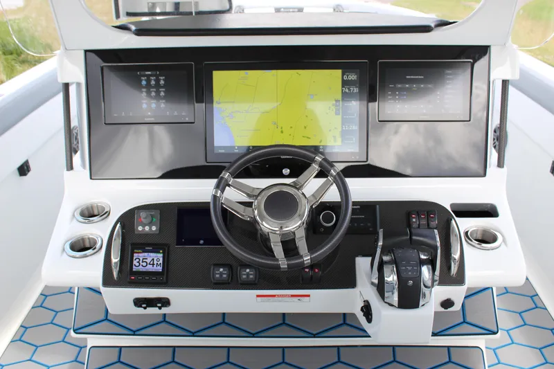 Slide: The Image of 2020 Mystic Powerboats M4200 dashboard with advanced navigation and control systems. - 35