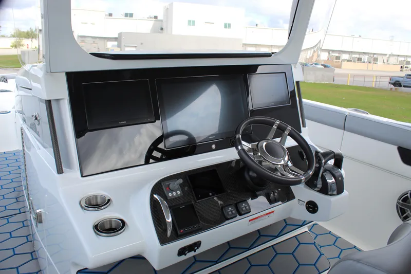 Slide: The Image of 2020 Mystic Powerboats M4200 helm with modern controls and sleek design. - 36