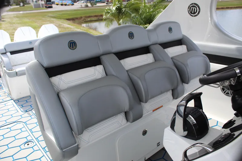 Slide: The Image of 2020 Mystic Powerboats M4200 interior with luxurious gray seating and modern design. - 38