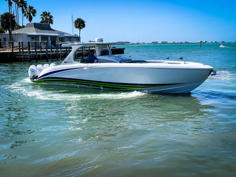 Slide: The Image of 2020 Mystic Powerboats M4200 cruising in sunny coastal waters. - 60