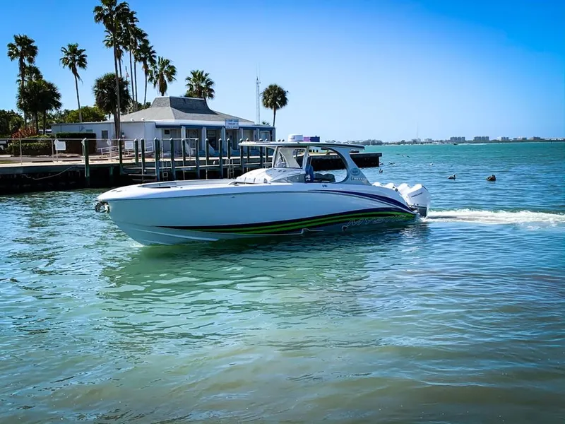 Slide: The Image of 2020 Mystic Powerboats M4200 cruising near a tropical shoreline. - 64