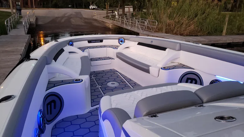 Slide: The Image of 2020 Mystic Powerboats M4200 interior with modern seating and ambient lighting. - 67