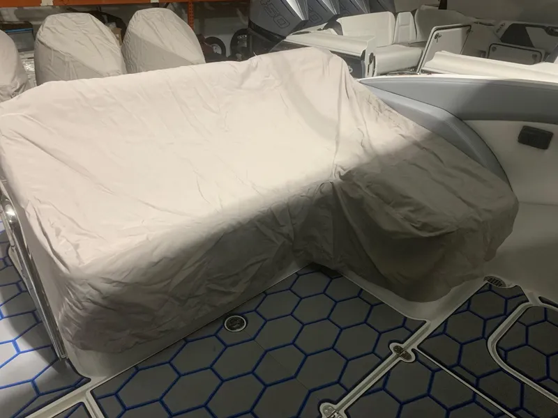 Slide: The Image of 2020 Mystic Powerboats M4200 interior with covered seating and hexagonal floor design. - 70