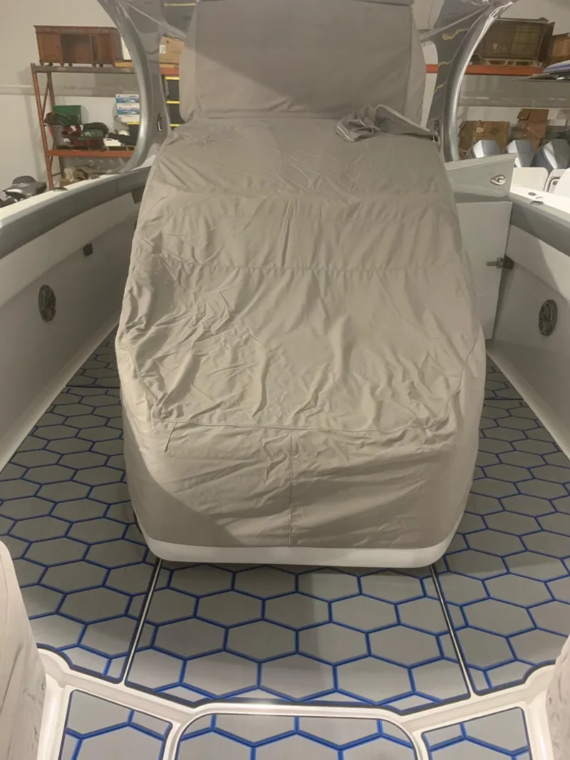 Slide: The Image of 2020 Mystic Powerboats M4200 interior with covered seating and hexagonal floor design. - 71