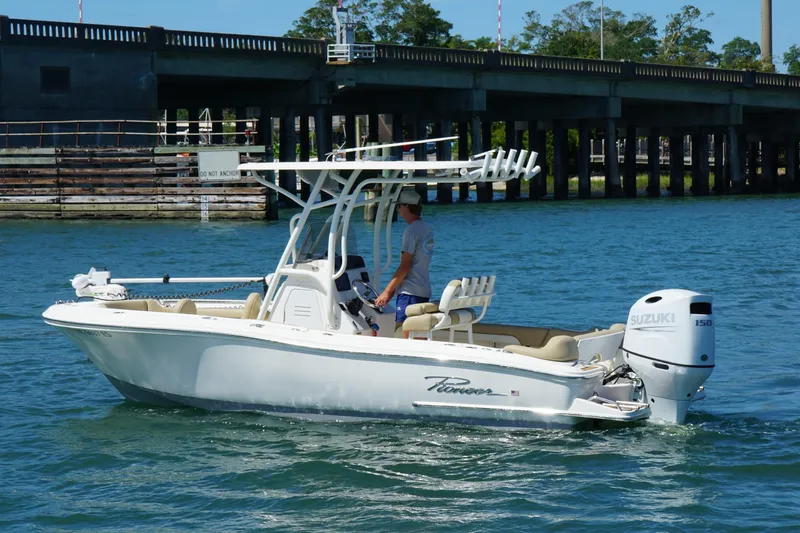 Slide: The Image of 2021 Pioneer 202 Islander boat with Suzuki engine on a calm waterway. - 3