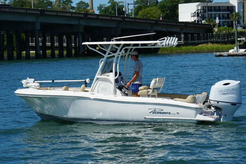 Slide: The Image of 2021 Pioneer 202 Islander boat on water, featuring Suzuki outboard motor. - 7
