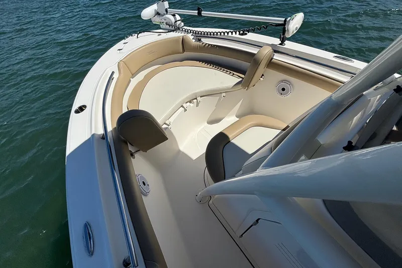 Slide: The Image of 2021 Pioneer 202 Islander boat interior with seating, on calm water. - 9